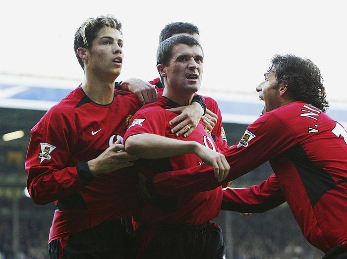 LEEDS, ENGLAND - OCTOBER 18:  Roy Keane of Man Utd celebrates with Ruud Van Nistelrooy and Cristiano Ronaldo after scoring the winning goal during the FA Barclaycard Premiership match between Leeds United and Manchester United at Elland Road on October 18, 2003 in Leeds, England. (Photo by Laurence Griffiths/Getty Images)