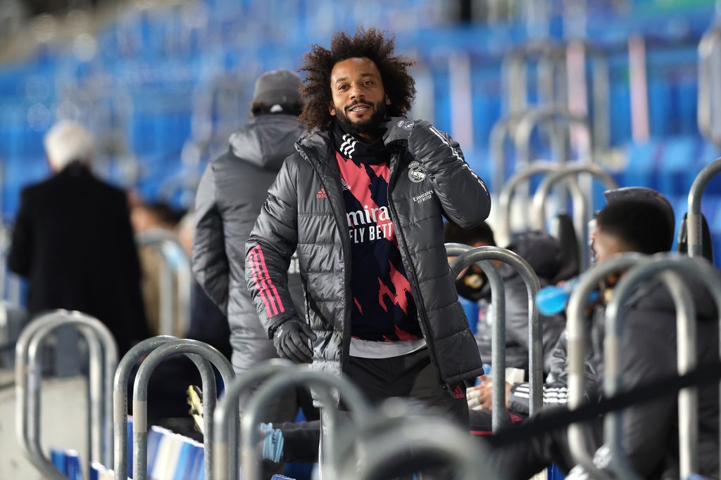 MADRID, SPAIN - DECEMBER 12: Marcelo of Real Madrid looks on from the substitute bench during the La Liga Santander match between Real Madrid and Atlético de Madrid at Alfedo Di Stefano Stadium on December 12, 2020 in Madrid, Spain .  Sports stadiums in Spain remain under strict restrictions due to the coronavirus pandemic, as the government's social distancing laws prohibit fans from entering venues, causing matches to be played behind closed doors.  (Photo by Angel Martinez / Getty Images)