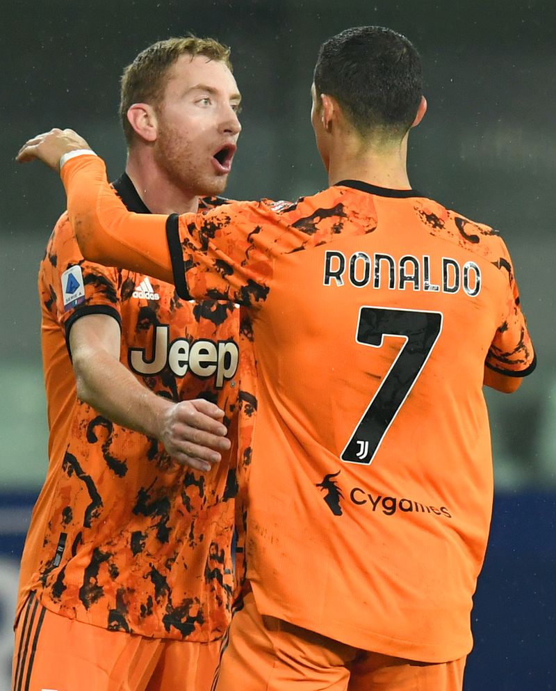 PARMA, ITALY - DECEMBER 19:  Cristiano Ronaldo of Juventus F.C.  celebrates with Dejan Kulusevski  after scoring their team's second goal  during the Serie A match between Parma Calcio and Juventus at Stadio Ennio Tardini on December 19, 2020 in Parma, Italy. Sporting stadiums around Italy  remain under strict restrictions due to the Coronavirus Pandemic as Government social distancing laws prohibit fans inside venues resulting in games being played behind closed doors. (Photo by Alessandro Sabattini/Getty Images)