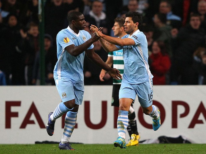 MANCHESTER, ENGLAND - MARCH 15: Micah Richards celebrates with goal scorer Sergio Aguero of Man City during the UEFA Europa League round of 16 second leg match between Manchester City FC and Sporting Lisbon at Etihad Stadium on March 15, 2012 in Manchester, England.  (Photo by Alex Livesey/Getty Images)
