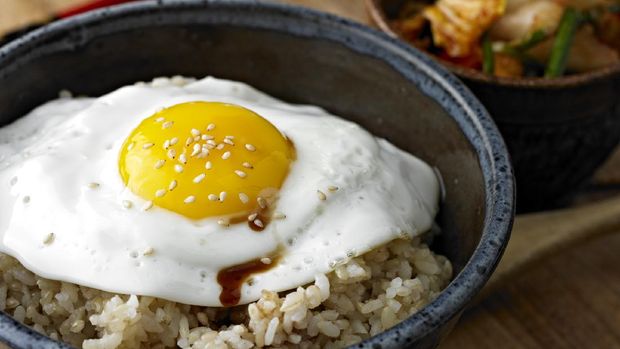 Fried Egg over Brown Rice with Soy Sauce and Sesame Seeds.