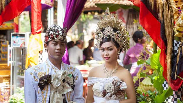 Bali, Indonesia - February 11. Woman enacting wedding scene in preparation for religious ceremony on February 11, 2012 in Bali, Indonesia. Most Balinese get married in their early 20s.