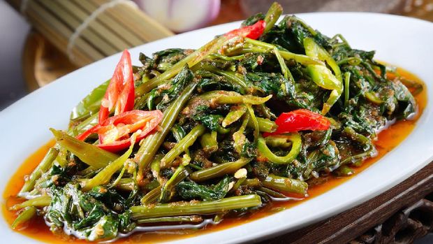 Closeup of cah kangkung, kangkong, or water spinach stirred.