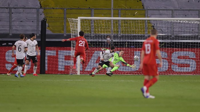 DUISBURG, GERMANY - MARCH 31: Eljif Elmas of North Macedonia scores their sides second goal during the FIFA World Cup 2022 Qatar qualifying match between Germany and North Macedonia at Schauinsland-Reisen-Arena on March 31, 2021 in Duisburg, Germany. Sporting stadiums around Germany remain under strict restrictions due to the Coronavirus Pandemic as Government social distancing laws prohibit fans inside venues resulting in games being played behind closed doors. (Photo by Alex Grimm/Getty Images)