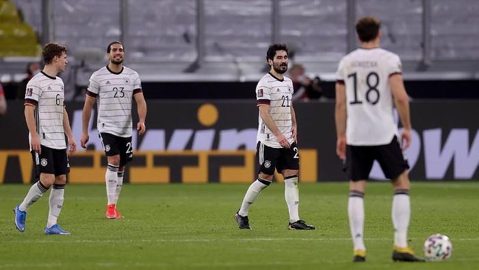 DUISBURG, GERMANY - MARCH 31: Joshua Kimmich, Ilkay Gundogan and Emre Can of Germany react after conceding their sides second goal during the FIFA World Cup 2022 Qatar qualifying match between Germany and North Macedonia at Schauinsland-Reisen-Arena on March 31, 2021 in Duisburg, Germany. Sporting stadiums around Germany remain under strict restrictions due to the Coronavirus Pandemic as Government social distancing laws prohibit fans inside venues resulting in games being played behind closed doors. (Photo by Alex Grimm/Getty Images)