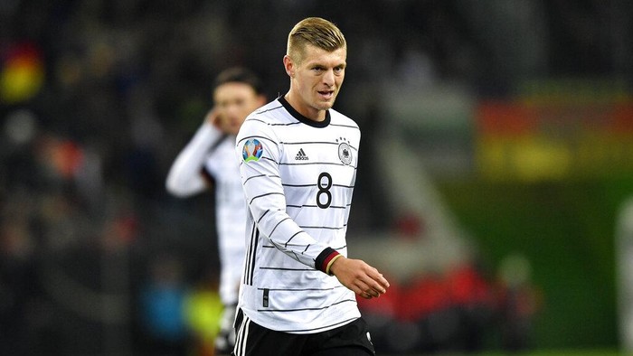 FILE - In this Saturday, Nov. 16, 2019 file photo, Germanys Toni Kroos plays during their Euro 2020 group C qualifying soccer match against Belarus in Moenchengladbach, Germany. Kroos on Wednesday, March 31, 2021 said it was “wrong” that Qatar was awarded next years World Cup and added that it could be appropriate to highlight human rights issues during the tournament. His comments go beyond the criticism from several national teams, including Germany and Norway, which tried to draw attention to human rights issues ahead of recent World Cup qualifying matches. (AP Photo/Martin Meissner, file)