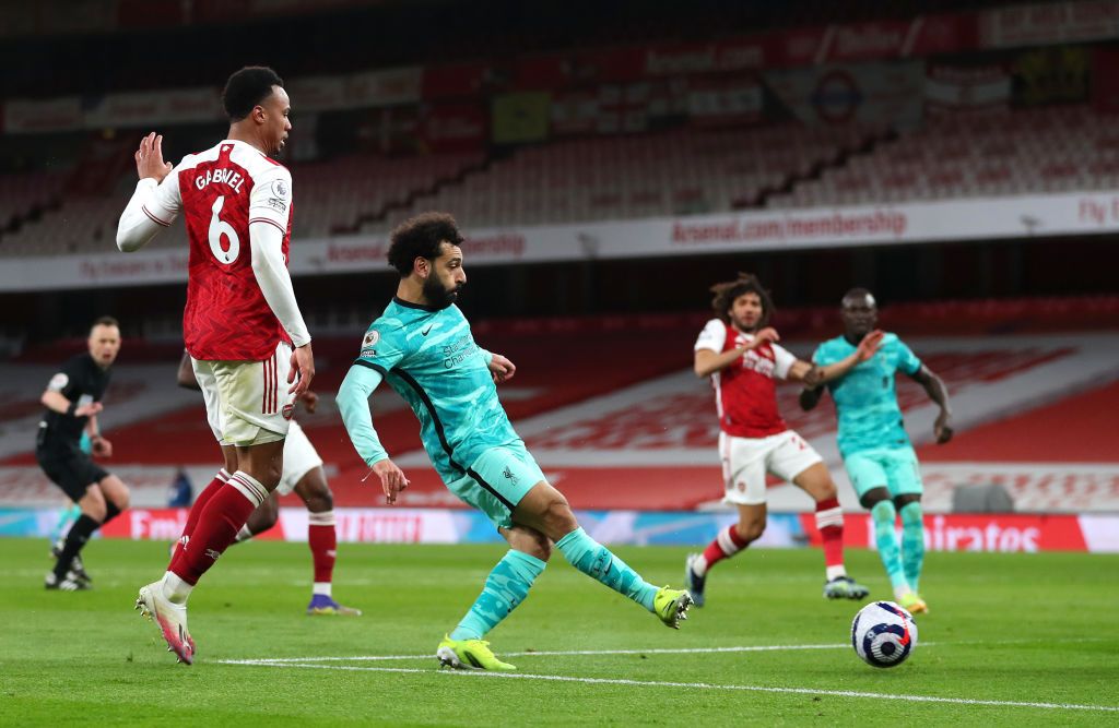 LONDON, ENGLAND - APRIL 03: Diogo Jota of Liverpool celebrates with Trent Alexander-Arnold, Mohamed Salah and teammates after scoring their team's first goal during the Premier League match between Arsenal and Liverpool at Emirates Stadium on April 03, 2021 in London, England. Sporting stadiums around the UK remain under strict restrictions due to the Coronavirus Pandemic as Government social distancing laws prohibit fans inside venues resulting in games being played behind closed doors. (Photo by Catherine Ivill/Getty Images)