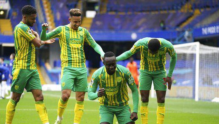 West Bromwich Albions Mbaye Diagne celebrates scoring their fourth goal during the English Premier League soccer match between Chelsea and West Bromwich Albion at Stamford Bridge stadium in London, England, Saturday, April 3, 2021.(John Walton/Pool via AP)