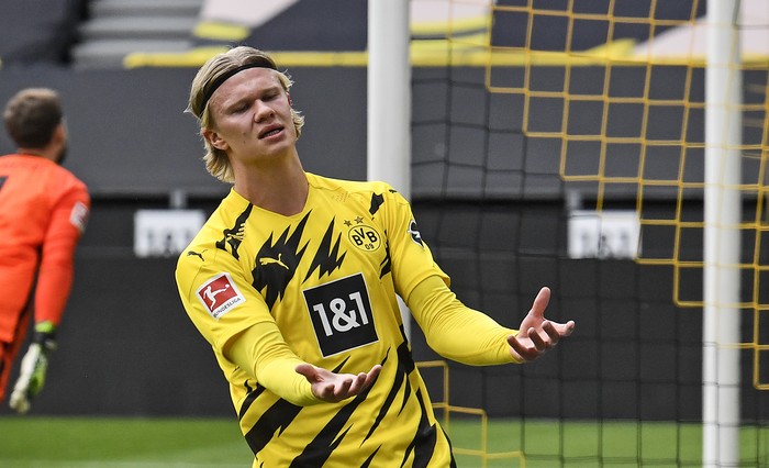 Dortmunds Erling Haaland reacts after missing a chance during the German Bundesliga soccer match between Borussia Dortmund and Eintracht Frankfurt in Dortmund, Germany, Saturday, April 3, 2021. (AP Photo/Martin Meissner, Pool)