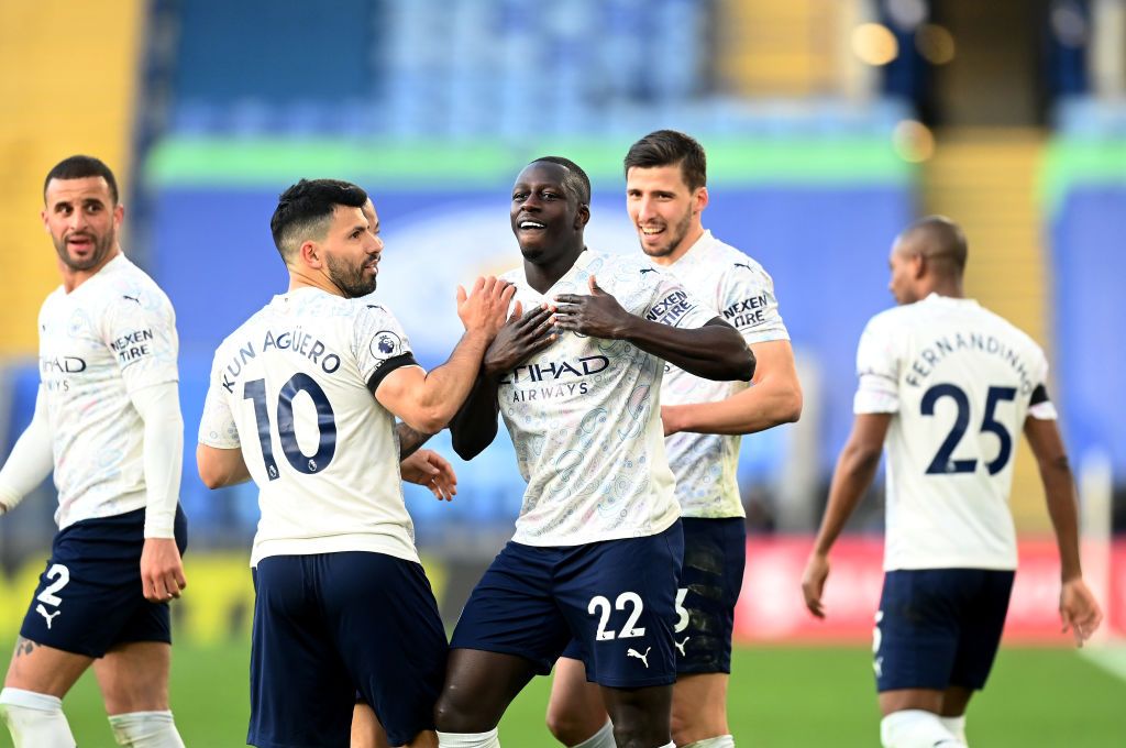 LEICESTER, ENGLAND - APRIL 03: Benjamin Mendy of Manchester City celebrates with team mates Ruben Dias and Sergio Aguero after scoring their side's first goal during the Premier League match between Leicester City and Manchester City at The King Power Stadium on April 03, 2021 in Leicester, England. Sporting stadiums around the UK remain under strict restrictions due to the Coronavirus Pandemic as Government social distancing laws prohibit fans inside venues resulting in games being played behind closed doors. (Photo by Michael Regan/Getty Images)
