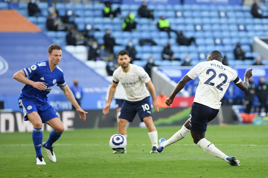 LEICESTER, ENGLAND - APRIL 03: Benjamin Mendy of Manchester City celebrates with team mates Ruben Dias and Sergio Aguero after scoring their side's first goal during the Premier League match between Leicester City and Manchester City at The King Power Stadium on April 03, 2021 in Leicester, England. Sporting stadiums around the UK remain under strict restrictions due to the Coronavirus Pandemic as Government social distancing laws prohibit fans inside venues resulting in games being played behind closed doors. (Photo by Michael Regan/Getty Images)