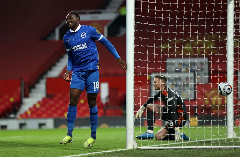 MANCHESTER, ENGLAND - APRIL 04: Danny Welbeck of Brighton & Hove Albion scores their team's first goal during the Premier League match between Manchester United and Brighton & Hove Albion at Old Trafford on April 04, 2021 in Manchester, England. Sporting stadiums around the UK remain under strict restrictions due to the Coronavirus Pandemic as Government social distancing laws prohibit fans inside venues resulting in games being played behind closed doors. (Photo by Phil Noble - Pool/Getty Images)