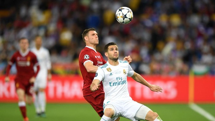 KIEV, UKRAINE - MAY 26:  Nacho Fernandez of Real Madrid is challenged by James Milner of Liverpool during the UEFA Champions League Final between Real Madrid and Liverpool at NSC Olimpiyskiy Stadium on May 26, 2018 in Kiev, Ukraine.  (Photo by Shaun Botterill/Getty Images)