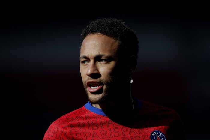 PSGs Neymar warms up before the French League One soccer match between Paris Saint Germain and Lille, at the Parc des Princes stadium, in Paris, France, Saturday, April. 3, 2021. (AP Photo/Christophe Ena)