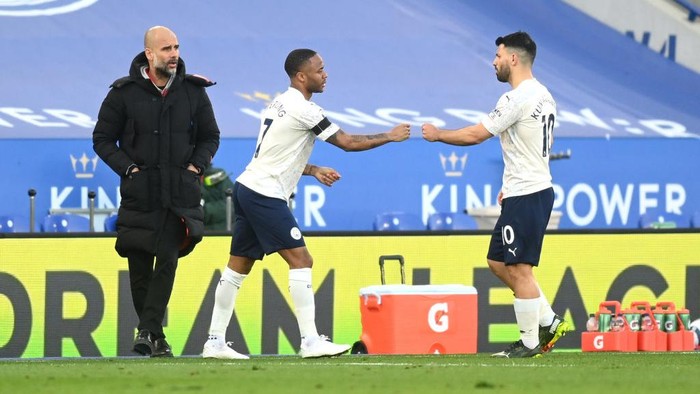 LEICESTER, ENGLAND - APRIL 03: Raheem Sterling of Manchester City comes on to replace Sergio Aguero of Manchester City as Pep Guardiola, Manager of Manchester City looks on  during the Premier League match between Leicester City and Manchester City at The King Power Stadium on April 03, 2021 in Leicester, England. Sporting stadiums around the UK remain under strict restrictions due to the Coronavirus Pandemic as Government social distancing laws prohibit fans inside venues resulting in games being played behind closed doors. (Photo by Michael Regan/Getty Images)