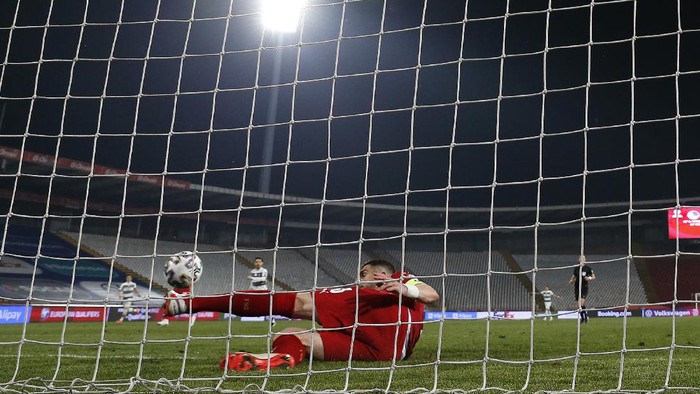 BELGRADE, SERBIA - MARCH 27: Stefan Mitrovic of Serbia clears the ball off the line during the FIFA World Cup 2022 Qatar qualifying match between Serbia and Portugal at FK Crvena Zvezda stadium on March 27, 2021 in Belgrade, Serbia. Sporting stadiums around Serbia remain under strict restrictions due to the Coronavirus Pandemic as Government social distancing laws prohibit fans inside venues resulting in games being played behind closed doors.  (Photo by Srdjan Stevanovic/Getty Images)
