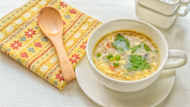 Egg drop soup is a Chinese soup of wispy beaten eggs in boiled chicken broth. Condiments such as black pepper or white pepper, and finely chopped scallions and tofu are also commonly added.