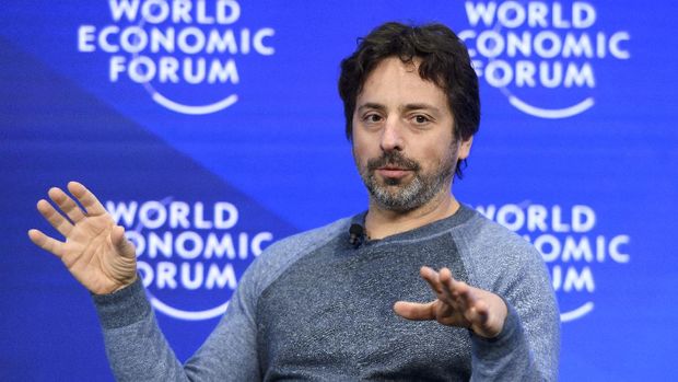 Google co-founder Sergey Brin gestures during a session of the World Economic Forum, on January 19, 2017 in Davos. (Photo by FABRICE COFFRINI / AFP)