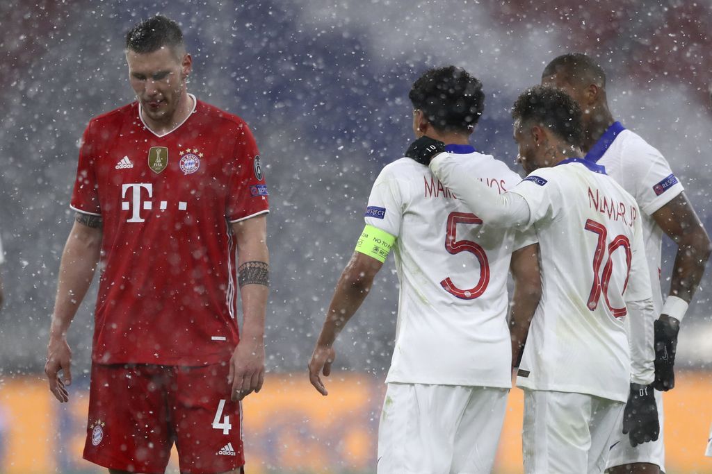 PSG's players celebrate their side's second goal during the Champions League quarterfinal soccer match between Bayern Munich and Paris Saint Germain in Munich, Germany, Wednesday, April 7, 2021. (AP Photo/Matthias Schrader)