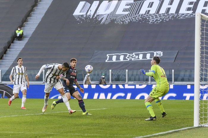 Juventus Cristiano Ronaldo heads the ball during the Italian Serie A soccer match between Juventus and Napoli at the Allianz Stadium in Turin, Italy, Wednesday, April 7, 2021. (Fabio Ferrari/LaPresse via AP)