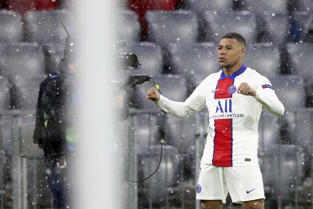 PSG's Kylian Mbappe celebrates after scoring the opening goal of his team during the Champions League quarterfinal soccer match between Bayern Munich and Paris Saint Germain in Munich, Germany, Wednesday, April 7, 2021. (AP Photo/Matthias Schrader)