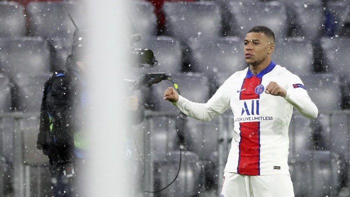 PSGs Kylian Mbappe celebrates after scoring the opening goal of his team during the Champions League quarterfinal soccer match between Bayern Munich and Paris Saint Germain in Munich, Germany, Wednesday, April 7, 2021. (AP Photo/Matthias Schrader)
