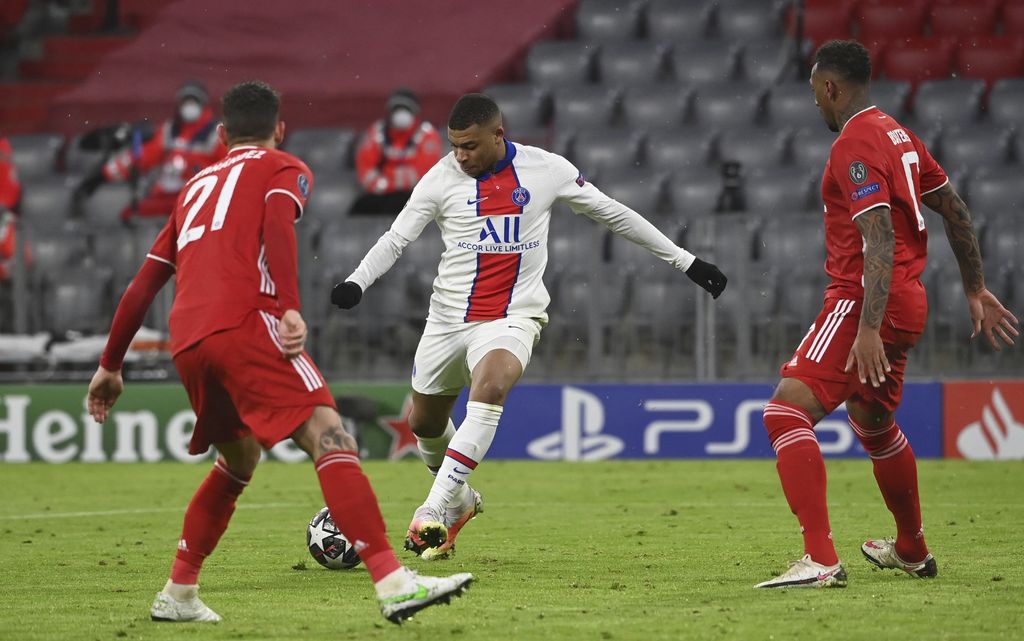 PSG's Kylian Mbappe celebrates after scoring the opening goal of his team during the Champions League quarterfinal soccer match between Bayern Munich and Paris Saint Germain in Munich, Germany, Wednesday, April 7, 2021. (AP Photo/Matthias Schrader)