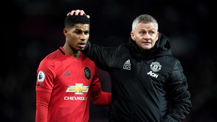 MANCHESTER, ENGLAND - DECEMBER 01: Marcus Rashford of Manchester United is consolled by Ole Gunnar Solskjaer, Manager of Manchester United after the Premier League match between Manchester United and Aston Villa at Old Trafford on December 01, 2019 in Manchester, United Kingdom. (Photo by Stu Forster/Getty Images)
