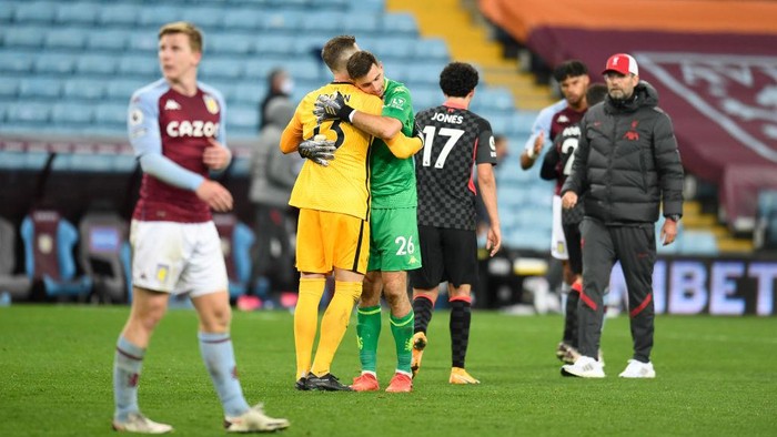BIRMINGHAM, ENGLAND - OCTOBER 04: Emiliano Martinez of Aston Villa embraces Adrian of Liverpool after the Premier League match between Aston Villa and Liverpool at Villa Park on October 04, 2020 in Birmingham, England. Sporting stadiums around the UK remain under strict restrictions due to the Coronavirus Pandemic as Government social distancing laws prohibit fans inside venues resulting in games being played behind closed doors. (Photo by Peter Powell - Pool/Getty Images)