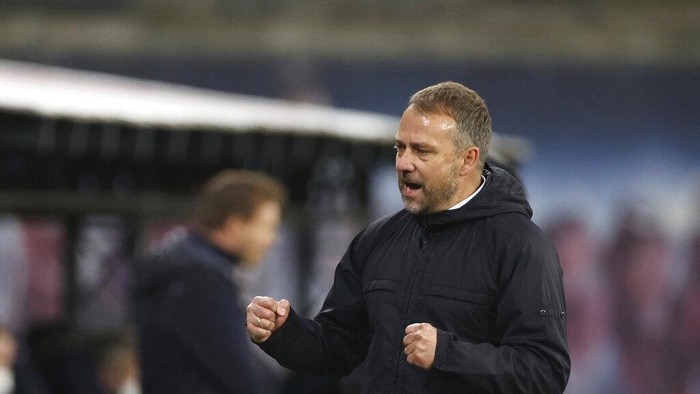 Hansi Flick Bayern's head coach Hans-Dieter Flick celebrates after the end of the German Bundesliga soccer match between RB Leipzig and Bayern Munich, in Leipzig, Germany, Saturday, April, 3, 2021. Bayern won the game 1-0, with Bayern's Leon Goretzka scoring the only goal of the match. (Jan Woitas/ Pool via AP)