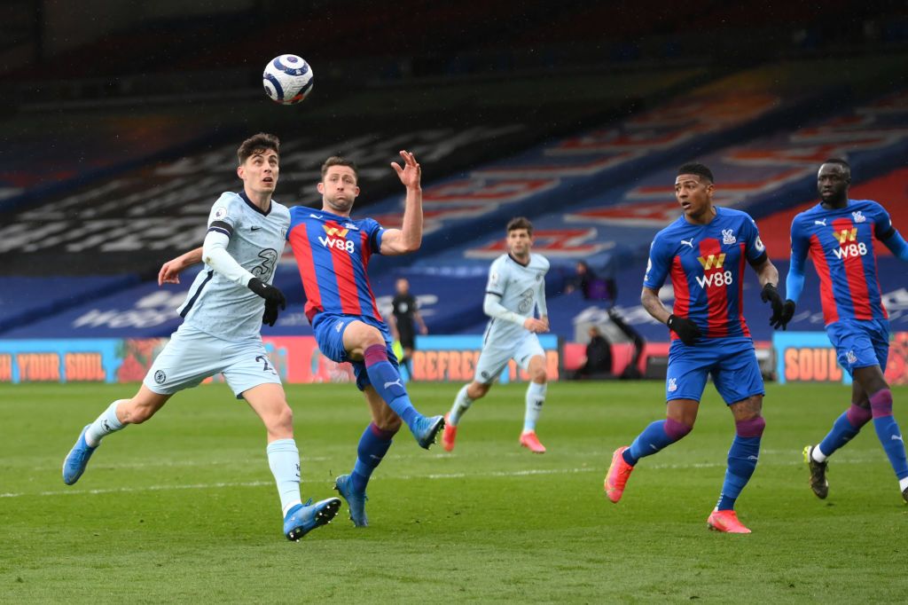 LONDON, ENGLAND - APRIL 10: Kai Havertz of Chelsea and Gary Cahill of Crystal Palace  battle for the ball  during the Premier League match between Crystal Palace and Chelsea at Selhurst Park on April 10, 2021 in London, England. Sporting stadiums around the UK remain under strict restrictions due to the Coronavirus Pandemic as Government social distancing laws prohibit fans inside venues resulting in games being played behind closed doors.  (Photo by Mike Hewitt/Getty Images)