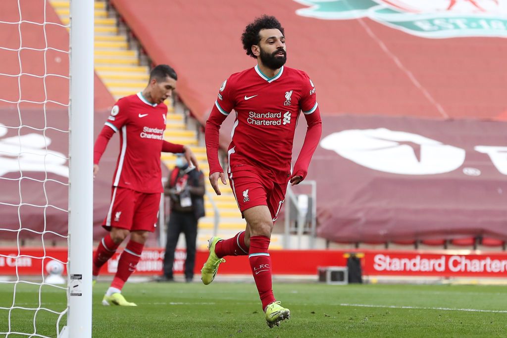 LIVERPOOL, ENGLAND - APRIL 10: Mohamed Salah of Liverpool celebrates after scoring their team's first goal during the Premier League match between Liverpool and Aston Villa at Anfield on April 10, 2021 in Liverpool, England. Sporting stadiums around the UK remain under strict restrictions due to the Coronavirus Pandemic as Government social distancing laws prohibit fans inside venues resulting in games being played behind closed doors.  (Photo by Martin Rickett - Pool/Getty Images)