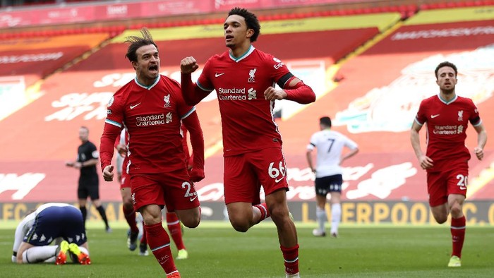 LIVERPOOL, ENGLAND - APRIL 10: Trent Alexander-Arnold of Liverpool celebrates with teammate Xherdan Shaqiri after scoring their teams second goal during the Premier League match between Liverpool and Aston Villa at Anfield on April 10, 2021 in Liverpool, England. Sporting stadiums around the UK remain under strict restrictions due to the Coronavirus Pandemic as Government social distancing laws prohibit fans inside venues resulting in games being played behind closed doors.  (Photo by Clive Brunskill/Getty Images)