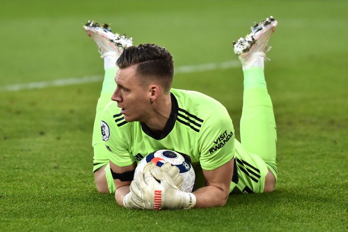 SHEFFIELD, ENGLAND - APRIL 11: Bernd Leno of Arsenal makes a save during the Premier League match between Sheffield United and Arsenal at Bramall Lane on April 11, 2021 in Sheffield, England. Sporting stadiums around the UK remain under strict restrictions due to the Coronavirus Pandemic as Government social distancing laws prohibit fans inside venues resulting in games being played behind closed doors. (Photo by Rui Vieira - Pool/Getty Images)