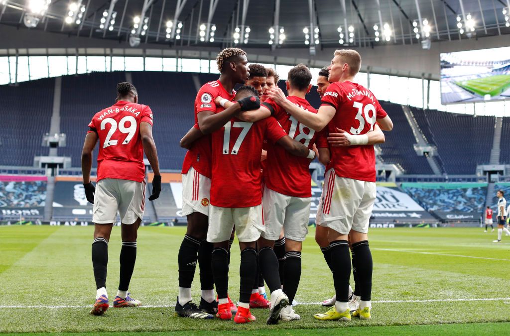 LONDON, ENGLAND - APRIL 11: Fred of Manchester United celebrates with Paul Pogba, Bruno Fernandes and Scott McTominay after scoring their team's first goal during the Premier League match between Tottenham Hotspur and Manchester United at Tottenham Hotspur Stadium on April 11, 2021 in London, England. Sporting stadiums around the UK remain under strict restrictions due to the Coronavirus Pandemic as Government social distancing laws prohibit fans inside venues resulting in games being played behind closed doors. (Photo by Adrian Dennis - Pool/Getty Images)