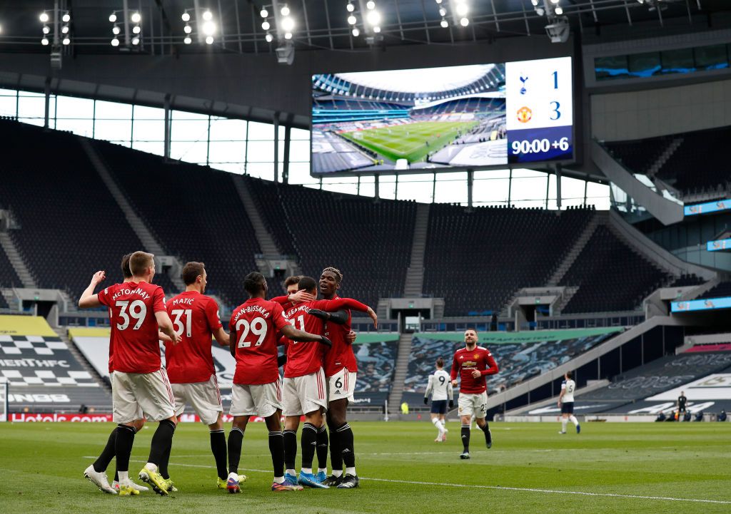 LONDON, ENGLAND - APRIL 11: Mason Greenwood of Manchester United celebrates with Scott McTominay and Harry Maguire after scoring their side's third goal during the Premier League match between Tottenham Hotspur and Manchester United at Tottenham Hotspur Stadium on April 11, 2021 in London, England. Sporting stadiums around the UK remain under strict restrictions due to the Coronavirus Pandemic as Government social distancing laws prohibit fans inside venues resulting in games being played behind closed doors. (Photo by Adrian Dennis - Pool/Getty Images)