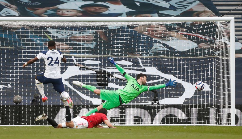 Tottenham Hotspur Vs Manchester United LONDON, ENGLAND - APRIL 11: Edinson Cavani of Manchester United scores their side's second goal past Hugo Lloris of Tottenham Hotspur during the Premier League match between Tottenham Hotspur and Manchester United at Tottenham Hotspur Stadium on April 11, 2021 in London, England. Sporting stadiums around the UK remain under strict restrictions due to the Coronavirus Pandemic as Government social distancing laws prohibit fans inside venues resulting in games being played behind closed doors. (Photo by Matthew Childs - Pool/Getty Images)