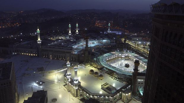 Muslims pray during the first dawn prayers of the Islamic holy month of Ramadan, at the Grand Mosque, in the Muslim holy city of Mecca, Saudi Arabia, Tuesday, April 13, 2021. During Ramadan, the holiest month in Islamic calendar, Muslims refrain from eating, drinking, smoking and sex from dawn to dusk.(AP Photo/Amr Nabil)