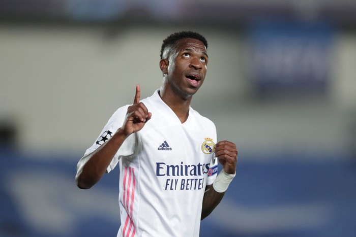 MADRID, SPAIN - APRIL 06: Vinicius Junior of Real Madrid CF celebrates scoring their third goal during the UEFA Champions League Quarter Final match between Real Madrid and Liverpool FC at Estadio Alfredo Di Stefano on April 06, 2021 in Madrid, Spain. Sporting stadiums around Spain remain under strict restrictions due to the Coronavirus Pandemic as Government social distancing laws prohibit fans inside venues resulting in games being played behind closed doors. (Photo by Gonzalo Arroyo Moreno/Getty Images)