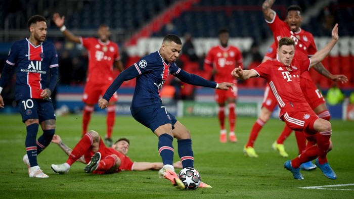 PARIS, FRANCE - APRIL 13: Kylian Mbappe of Paris Saint-Germain breaks away to shpoo during the UEFA Champions League Quarter Final Second Leg match between Paris Saint-Germain and FC Bayern Munich at Parc des Princes on April 13, 2021 in Paris, France. Sporting stadiums around France remain under strict restrictions due to the Coronavirus Pandemic as Government social distancing laws prohibit fans inside venues resulting in games being played behind closed doors. (Photo by Matthias Hangst/Getty Images)