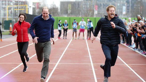 FILE - In this file photo dated Sunday, Feb. 5, 2017, Britain's Prince Harry, right, races to the line against Prince William, and Kate, the Duchess of Cambridge, left, during a training event to promote their charity Heads Together, at the Queen Elizabeth II Park in London.  Many observers believe that the upcoming funeral for Prince Philip, on Saturday April 17, 2021, will provide an ideal opportunity for the brothers to smooth over tensions.(AP Photo/Alastair Grant, Pool)