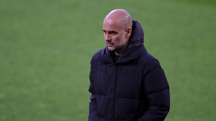 DORTMUND, GERMANY - APRIL 14: Pep Guardiola, Manager of Manchester City looks on prior to the UEFA Champions League Quarter Final Second Leg match between Borussia Dortmund and Manchester City at Signal Iduna Park on April 14, 2021 in Dortmund, Germany. Sporting stadiums around Germany remain under strict restrictions due to the Coronavirus Pandemic as Government social distancing laws prohibit fans inside venues resulting in games being played behind closed doors.  (Photo by Friedemann Vogel - Pool/Getty Images)