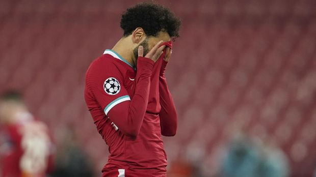 Liverpool's Mohamed Salah reacts after a missed scoring opportunity during a Champions League quarter final second leg soccer match between Liverpool and Real Madrid at Anfield stadium in Liverpool, England, Wednesday, April 14, 2021. (AP Photo/Jon Super)