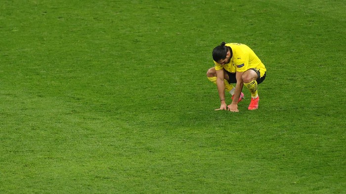DORTMUND, GERMANY - APRIL 14: Emre Can of Borussia Dortmund looks dejected following the UEFA Champions League Quarter Final Second Leg match between Borussia Dortmund and Manchester City at Signal Iduna Park on April 14, 2021 in Dortmund, Germany. Sporting stadiums around Germany remain under strict restrictions due to the Coronavirus Pandemic as Government social distancing laws prohibit fans inside venues resulting in games being played behind closed doors.  (Photo by Friedemann Vogel - Pool/Getty Images)