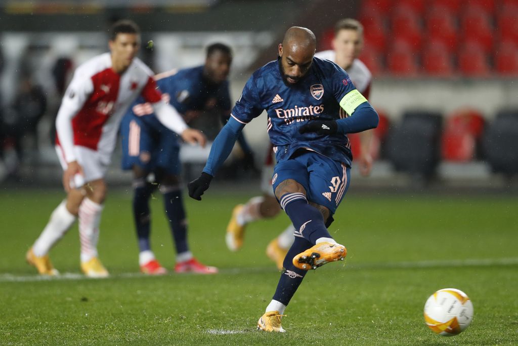 Arsenal's Alexandre Lacazette scores his side's second goal from the penalty spot during the Europa League quarter final second leg soccer match between Slavia Prague and Arsenal at the Sinobo stadium in Prague, Czech Republic, Thursday, April 15, 2021. (AP Photo/Petr David Josek)