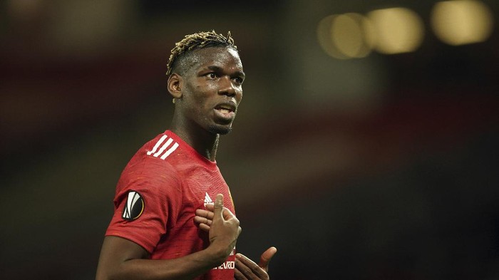Manchester Uniteds Paul Pogba gestures during the Europa League, quarterfinal, second leg soccer match between Manchester United and Granada at the Old Trafford stadium, in Manchester, Thursday, April 15, 2021. (AP Photo/Dave Thompson)