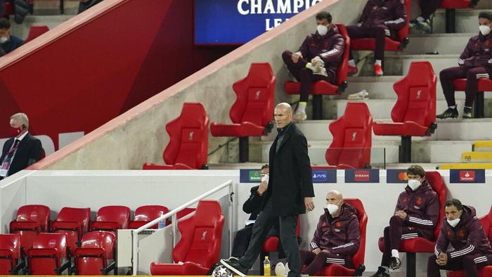 Real Madrids head coach Zinedine Zidane gestures during a Champions League quarter final second leg soccer match between Liverpool and Real Madrid at Anfield stadium in Liverpool, England, Wednesday, April 14, 2021. (AP Photo/Jon Super)