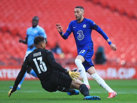 LONDON, ENGLAND - APRIL 17: Zack Steffen of Manchester City saves from Hakim Ziyech of Chelsea during the Semi Final of the Emirates FA Cup match between Manchester City and Chelsea FC at Wembley Stadium on April 17, 2021 in London, England. Sporting stadiums around the UK remain under strict restrictions due to the Coronavirus Pandemic as Government social distancing laws prohibit fans inside venues resulting in games being played behind closed doors.  (Photo by Adam Davy - Pool/Getty Images)
