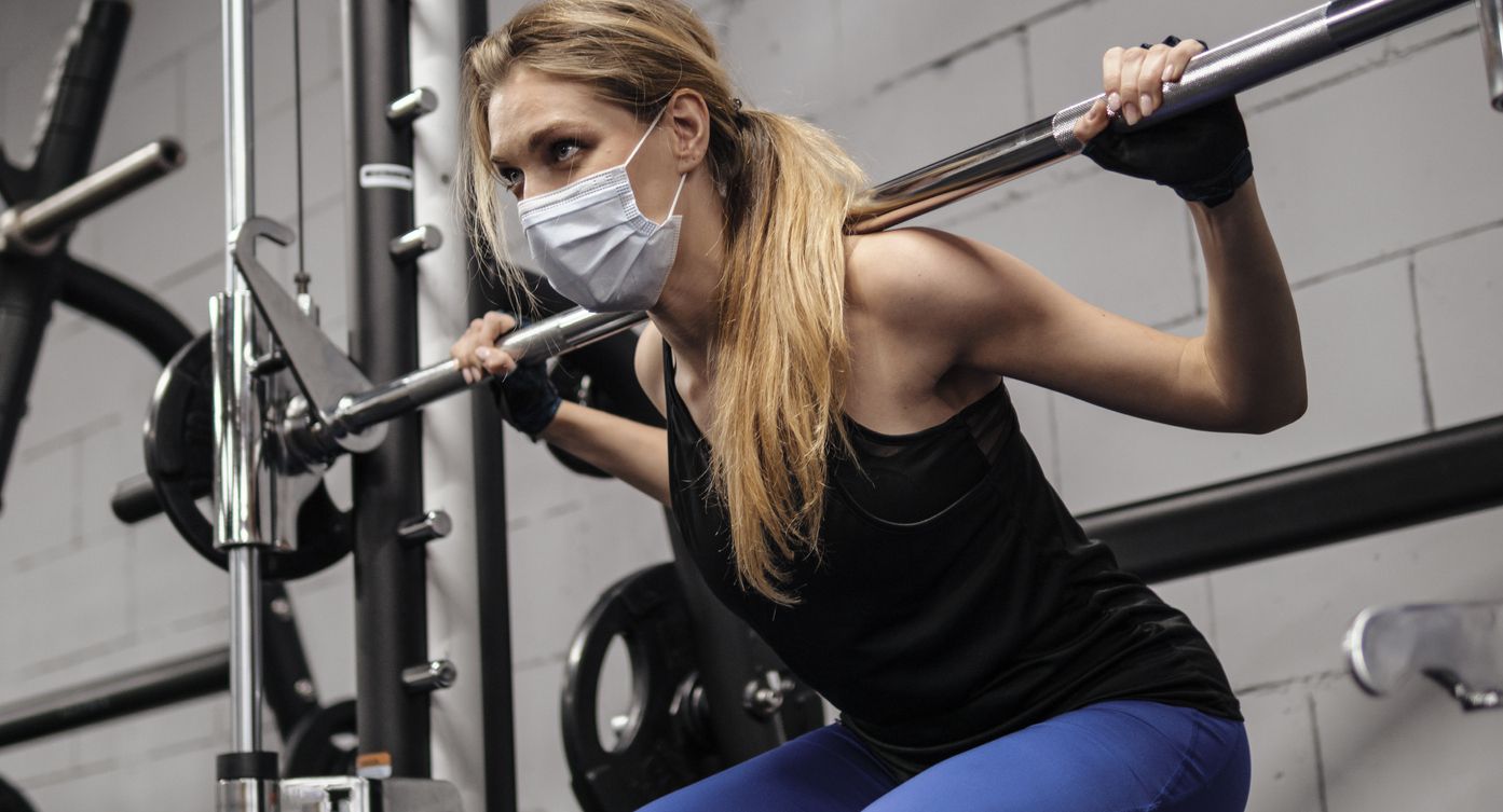 Person working out at gym during pandemic