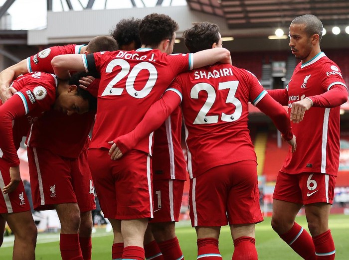LIVERPOOL, ENGLAND - APRIL 10: Trent Alexander-Arnold of Liverpool celebrates with teammates after scoring their team's second goalduring the Premier League match between Liverpool and Aston Villa at Anfield on April 10, 2021 in Liverpool, England. Sporting stadiums around the UK remain under strict restrictions due to the Coronavirus Pandemic as Government social distancing laws prohibit fans inside venues resulting in games being played behind closed doors. (Photo by Clive Brunskill/Getty Images)